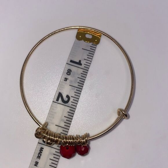 4/$20 Gold tone bangle with floating red beads - Picture 2 of 3